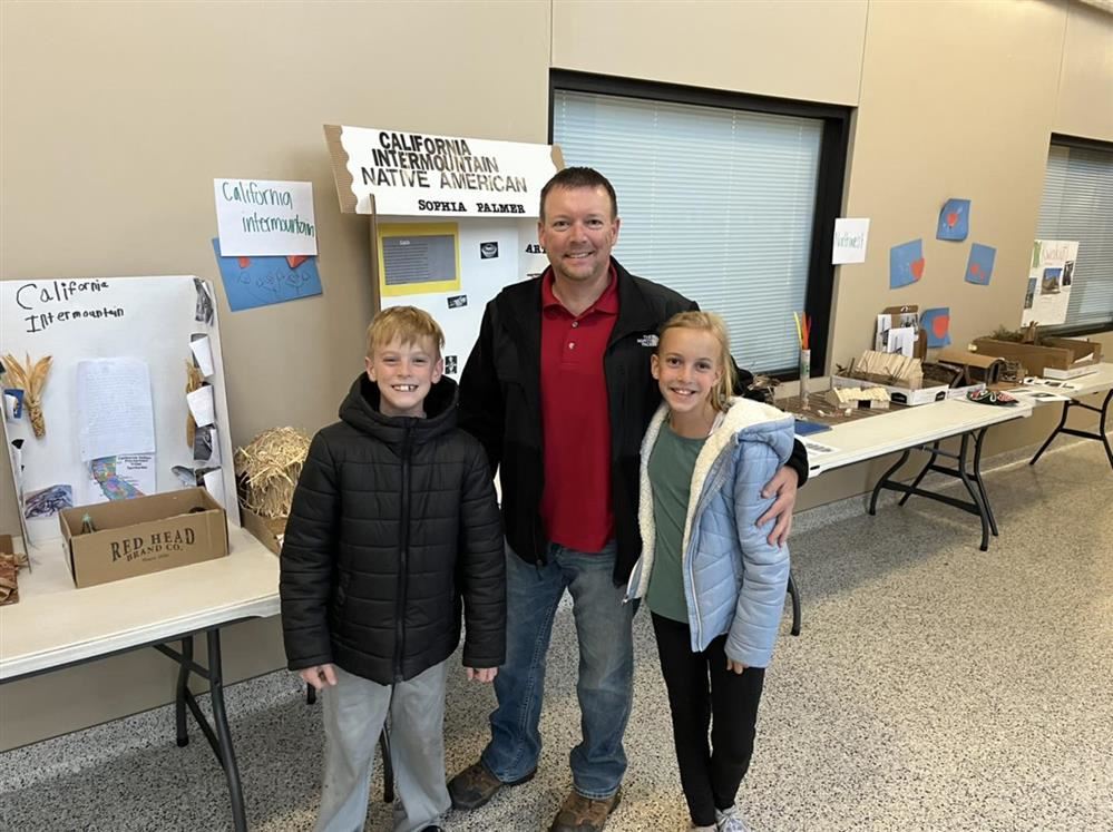  Colin, Megan and Mr. Smith enjoying the projects on display